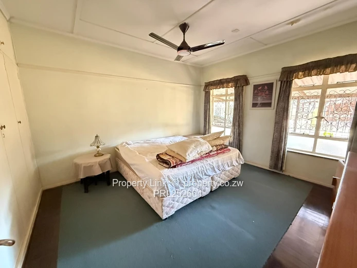 Double Entrance Corner Property With Potential!