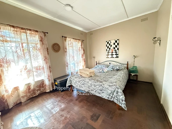 Double Entrance Corner Property With Potential!